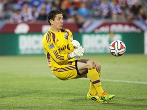 Impact goalkeeper Troy Perkins makes a save against the Colorado Rapids at Dick’s Sporting Goods Park on May 24, 2014 in Commerce City, Colo. The Rapids defeated the Impact 4-1.