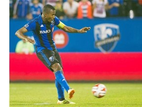 Impact’s Patrice Bernier scores the game-winning penalty kick against FC Edmonton during second half stoppage time during the second leg of the Canadian championship semifinal at Saputo Stadium in Montreal, Wednesday, May 14, 2014.
