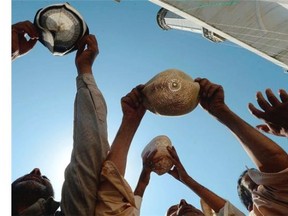 Kashmiri Muslims pray as an unseen custodian displays a holy relic, believed to be a hair from the Prophet Muhammad’s beard, during the last Friday of celebrations for Miraj-Ul-Alam (Ascension to Heaven) at Kashmir’s main Hazratbal Shrine in Srinagar on May 30, 2014. Thousands of Muslims converge annually for celebrations at the shrine near the summer capital of the state of Jammu and Kashmir.