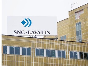 An SNC Lavalin sign displayed on top of a building at the MUHC super hospital Glen yards construction project in Montreal on Monday, March 4, 2013.