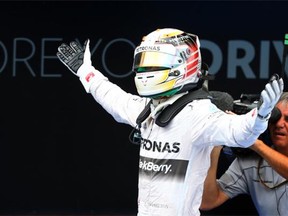 Lewis Hamilton of Great Britain and Mercedes GP celebrates following his victory during the Spanish Formula One Grand Prix at Circuit de Catalunya on May 11, 2014 in Montmelo, Spain.