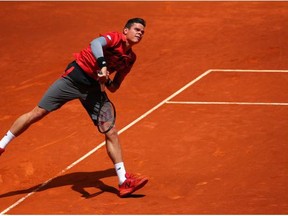 Milos Raonic in action against Ke Nishikori during day six of the Mutua Madrid Open tennis tournament at the Caja Magica on May 8, 2014 in Madrid.