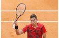 Milos Raonic from Canada celebrates his victory during a Madrid Open tennis tournament match against Jeremy Chardy from France, in Madrid, Spain, Tuesday, May 6, 2014.