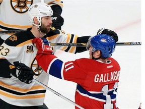 Montreal Canadiens Brendan Gallagher gets his stick up with Boston Bruins Zdeno Chara during first period of Game 6 of Stanley Cup playoff series in Montreal Monday, May 12, 2014.