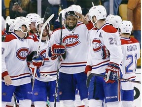 Montreal Canadiens defenseman P.K. Subban, middle, and his teammates celebrate after defeating the Boston Bruins 3-1 in Game 7 of an NHL hockey second-round playoff series in Boston, Wednesday, May 14, 2014.