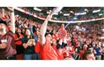 Montreal Canadiens fans celebrate the Habs first goal while watching Game 7 of Stanley Cup series against the Bruins in Boston, on the big screens at the Bell Centre in Montreal Wednesday May 14, 2014.