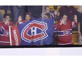 Montreal Canadiens fans watch warm ups prior to Game 2 in the second-round of the Stanley Cup hockey playoff series against the Boston Bruins in Boston, Saturday, May 3, 2014.