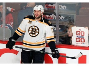 A Montreal Canadiens fan tries to distract Boston Bruins Milan Lucic during warmup prior to Game 6 of Stanley Cup playoff series in Montreal Monday May 12, 2014.