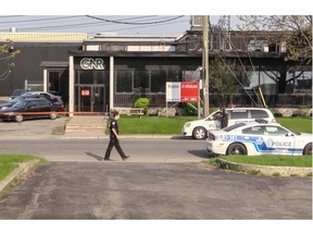 Montreal police are investigating a shooting incident in the parking lot of GNR Technologies on Upton St. in LaSalle early Thursday morning, May 15, 2014.