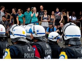 Montreal police riot squad stands by as students block an entrance to the Université de Montréal in 2012.