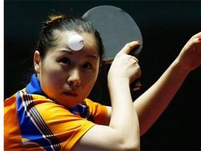 Li Jie of the Netherlands in action against Ni Xialian of Luxembourg during her women’s team competition second round match between the Netherlands and Luxembourg of the Table Tennis Team World Championships in Tokyo, Japan, 29 April 2014.