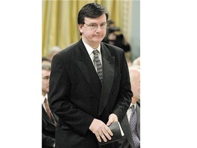 Gar Knutson is sworn into cabinet in 2003. The Liberals are concerned over his pro-life activities at his Catholic church.