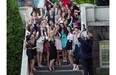 Queen of Angels Academy grads pose for a picture during a reception at the school in the Dorval area of Montreal Friday, May 30, 2014. After a rich 126-year history, Queen of Angels Academy in Dorval is set to close its doors this year, to be turned into an elementary school, with condos developed on some of the property. But alumnae are getting together to celebrate its past tonight, and keep the school alive, at least in spirit.