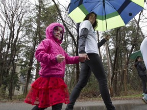 Marie-Josée St-Germain walks with 4-year-old daughter Melodie.