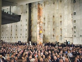 People attend the Dedication Ceremony of the National September 11 Memorial Museum in the museum’s Foundation Hall on Thursday, May 15, 2014 in New York.