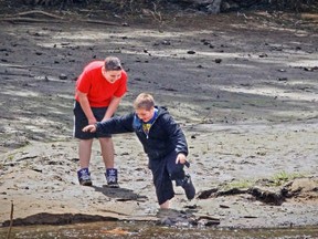 It's not just the kids playing in the ruins of Pine Lake that find themselves knee-deep in mud.