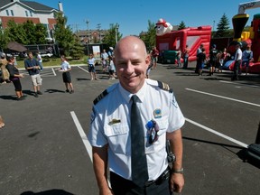 Station 5 commander Michel Wilson greets the community at 2010 open house. Connecting with the community is important for local stations. (Peter McCabe/THE GAZETTE)