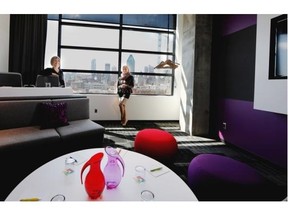 Co-president of Groupe Germain Hospitalite, Christiane Germain, right, and hotel manager manager Julie Brisebois display a conference room with views to the downtown skyline at the new ALT Hotel in the Griffintown district in Montreal on Tuesday May 6, 2014.