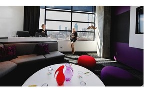 Co-president of Groupe Germain Hospitalite, Christiane Germain, right, and hotel manager manager Julie Brisebois display a conference room with views to the downtown skyline at the new ALT Hotel in the Griffintown district in Montreal on Tuesday May 6, 2014.