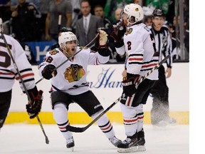 Duncan Keith (2) of the Chicago Blackhawks celebrates with Patrick Kane (88) after Keith scored a third-period goal against the Los Angeles Kings in Game Six of the Western Conference Final during the 2014 Stanley Cup Playoffs at Staples Center on May 30, 2014 in Los Angeles, California.
