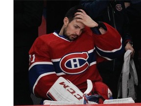 Goalie Carey Price of the Montreal Canadiens sits on the bench after he was replaced for the third period of the game by backup goalie Peter Budaj at the Bell Centre in Montreal on Saturday. Coach Michel Therrien announced to the media Monday that Price will miss the rest of the series against the Rangers.