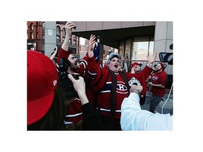 Ginette Reno impersonator Olivier Duclos sings O Canada outside Boston’s TD Garden before Game 7 of Canadiens-Bruins series on May 14, 2014. (Photo:  Brenda Branswell/The Gazette)