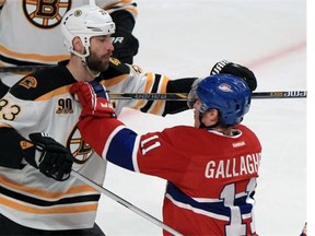 Canadiens' Brendan Gallagher gets his stick up with Bruins' Zdeno Chara during first period of Game 6 of Stanley Cup playoff series in Montreal on Monday.