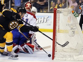 Montreal Canadiens defenseman Douglas Murray, left to right, keeps Boston Bruins Pat Fraser from the puck as Montreal Canadiens goalie Carey Price follows the play during game 4 of the second round of NHL playoff action at the Bell centre in Montreal on Thursday May 8, 2014. (Allen McInnis / THE GAZETTE)