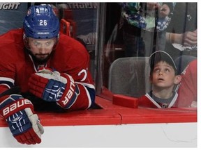 Canadiens' Josh Gorges sits at the end of the bench late in the third period as he and his teammates were being soundly beaten by the New York Rangers in the first game of  the Eastern Conference Final at the Bell Centre in Montrealon Saturday.