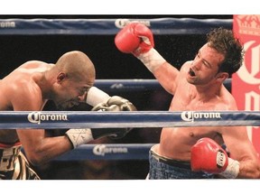 Joachim Alcine, left, misses Delvin Rodriguez with a punch during boxing card at the Olympic Stadium on Friday night.