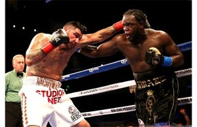 Montrealer Bermane Stiverne, right, battles Chris Arreola in their WBC Heavyweight Championship match in Los Angeles on Saturday.  Stiverne won in a six round technical knockout.