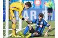 Impact goalkeeper Troy Perkins, left, helps teammate Jeb Brovsky up off the turf during second half action against Sporting Kansas City in Montreal on Saturday.