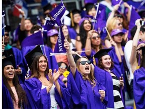 Students celebrate at the commencement of the 2014 New York University graduation ceremony at Yankee Stadium on May 21, 2014 in the Bronx borough of New York City. Janet Yellen, Chair of the Board of Governors of the Federal Reserve System, received an honorary doctorate and was the 2014 commencement speaker.