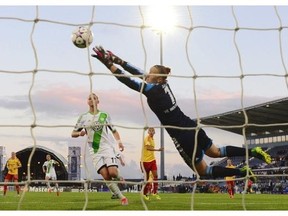 Tyreso’s Brazilian forward Marta (not in picture) scores past Wolfsburg’s goalkeeper Almuth Schult during the UEFA Women’s Champions League final football match Tyreso FF vs Vfl Wolfsburg at Restelo stadium in Lisbon on May 22, 2014.
