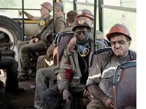 Ukrainian coal miners sit on a bus after finishing their shift at a coal mine outside Donetsk, Ukraine, Tuesday, May 20, 2014. While steel workers in Mariupol joined anti-separatist actions supported by the management of the plants, miners refused to take part in a planned protest against the Donetsk People’s Republic.