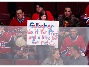 A young hockey fan sends a message to Canadiens’ Brendan Gallagher during the pregame skate before Game 2 of the Eastern Conference Final against the New York Rangers in Montreal on Monday.