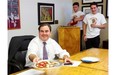 Andrew Molson, vice-chairman of the board of Molson Coors Brewing Corp., shares a sample of a dessert pizza made under the name La Sweetzzeria by students, including Luca Amorosa and John Miceli, at Loyola High School on Thursday, May 29, 2014.