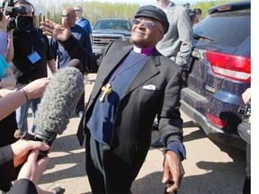 Archbishop Desmond Tutu speaks to media following a helicopter ride to take a look at the oilsands after he gave the keynote address at the conference, As Long as the Rivers Flow: Coming Back to the Treaty Relationship in Our Time, in Fort McMurray, Alberta on Saturday May 31, 2014.