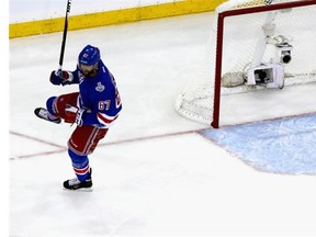 Benoit Pouliot (67) of the New York Rangers celebrates his goal on Jonathan Quick (32) of the Los Angeles Kings during the first period of Game Four of the 2014 NHL Stanley Cup Final at Madison Square Garden on June 11, 2014 in New York, New York.