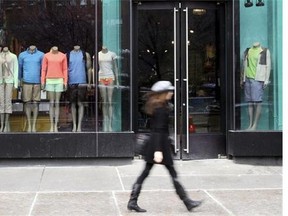 A pedestrian walks past the Lululemon Athletica store Tuesday, March 19, 2013 at Union Square in New York.