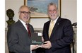 Quebec Premier Philippe Couillard, right, is handed a copy of the provincial budget by Finance Minister Carlos Leitao, Wednesday, June 4, 2014 at his office in Quebec City. The budget will be presented at the National Assembly later in the afternoon. THE CANADIAN PRESS/Jacques Boissinot