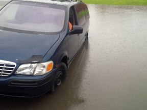 Swamped car at the corner of Manfred Ave. and Hymus Blvd. in Pointe-Claire