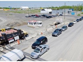 Cars line up in Laval to cross the toll bridge on Highway 25 to the island of Montreal in May 2011.