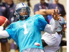 “I’m chomping at the bit, anxious for the opportunity to showcase who I am as a quarterback,” says Alouettes’ Troy Smith, throwing during the first day of the team’s training camp at Bishops University in Sherbrooke on Sunday.