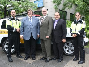 Left to right: inspector Mickael Culliford, interim City Manager Jean-Denis Jacob, Mayor Morris Trudeau, MIB planner Rejean Cauchon and inspector Catherine Paquette