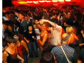 Dancing at a Montreal night club: A pilot project would allow some bars to stay open until 6 a.m..