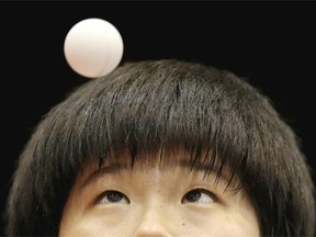 Lee Dasom of Korea serves against Hitomi Sato of Japan in their U21 Girls Singles match during day one of 2014 ITTF World Tour Japan Open at Yokohama Cultural Gymnasium on June 20, 2014 in Yokohama, Japan.