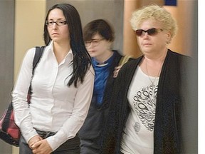 Emma Czornobaj, left, leaves the Montreal Court room with a supporter Monday, June 2, 2014. Czornobaj has been charged with criminal negligence and dangerous driving causing two deaths when she stopped her car on a highway to avoid hitting a family of ducks.