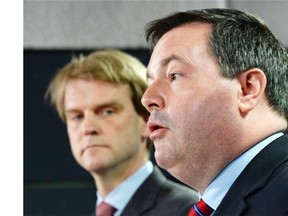Employment Minister Jason Kenney speaks at a news conference in Ottawa on Friday, June 20, 2014 on reforms to the Temporary Foreign Worker Program. Citizenship and Immigration Minister Chris Alexander is seen in background.