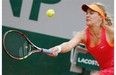 Eugenie Bouchard of Westmount returns the ball during the fourth round match of the French Open tennis tournament against Germany’s Angelique Kerber at the Roland Garros stadium, in Paris, France, Sunday, June 1, 2014.